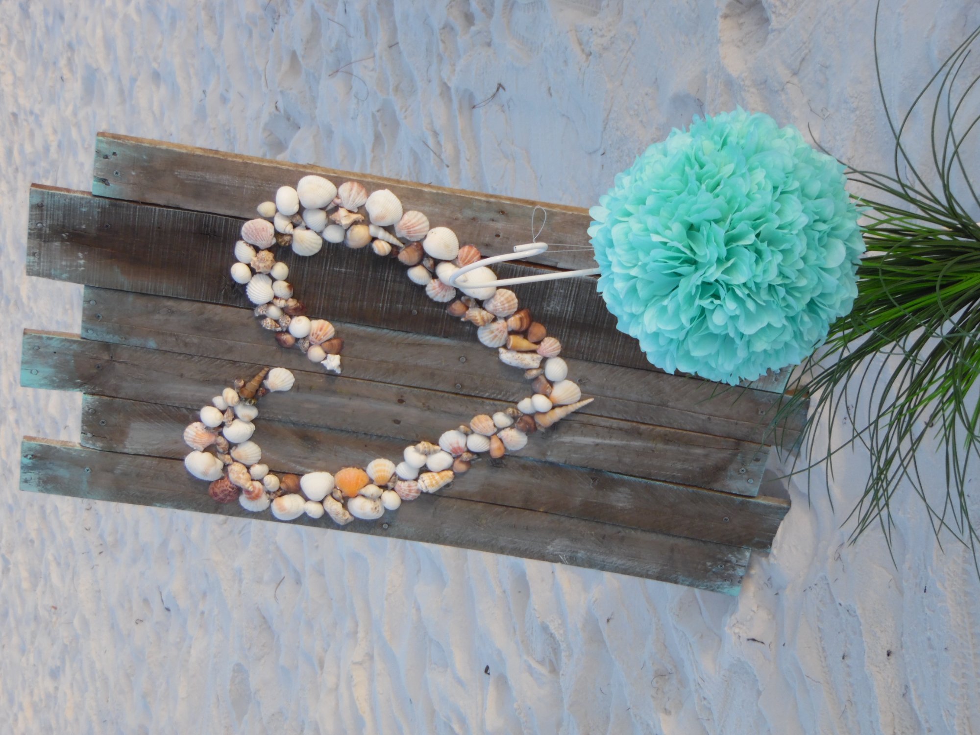 Bamboo arch with heart sand ring and starfish