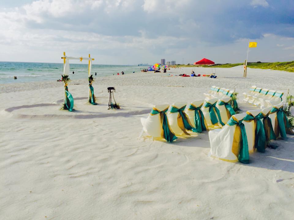 White covers with teal sashes beach