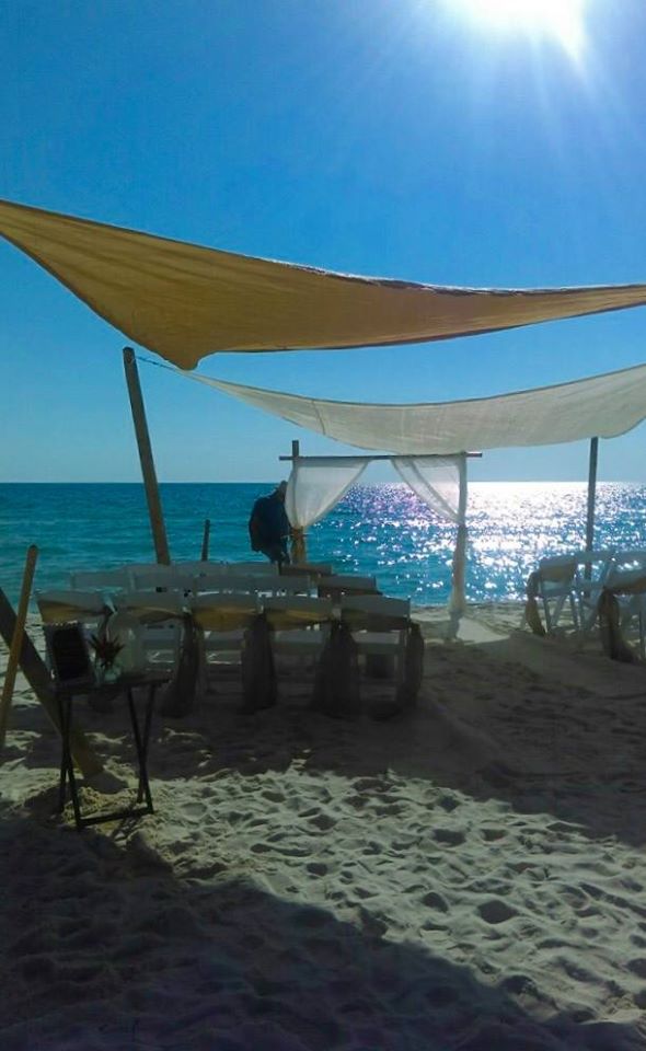 Shade sail at Gulf Coast beach ceremony